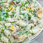 Creamy Bacon Ranch Pasta Salad combines crisp bacon, cheddar cheese, tender pasta with peas for a juicy bite with a creamy ranch dressing. A great summer pasta salad for any occasion.