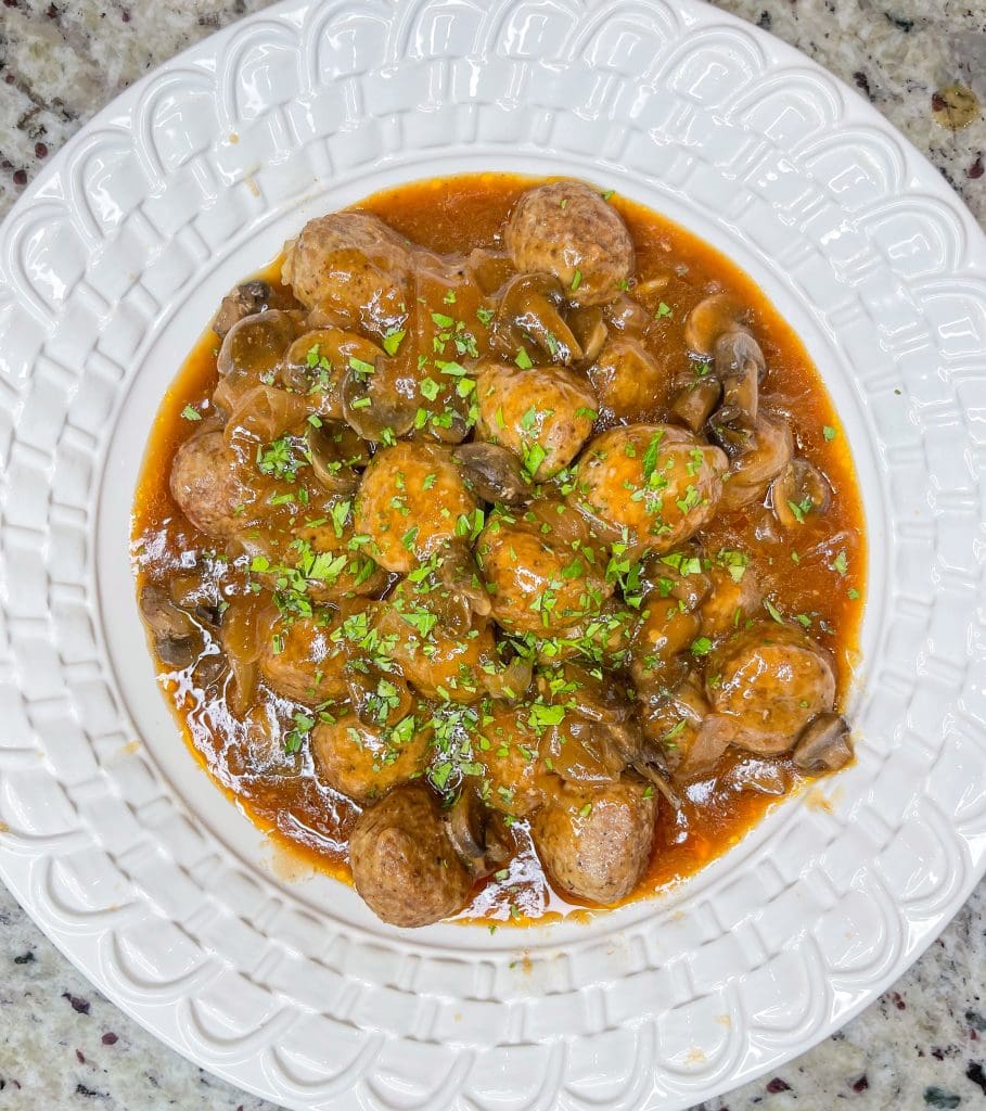 Crock Pot Salisbury Meatballs are juicy meatballs smothered in a flavorful brown gravy served over a big pile of fluffy mashed potatoes. The best thing about this recipe is that you can use homemade or frozen meatballs.