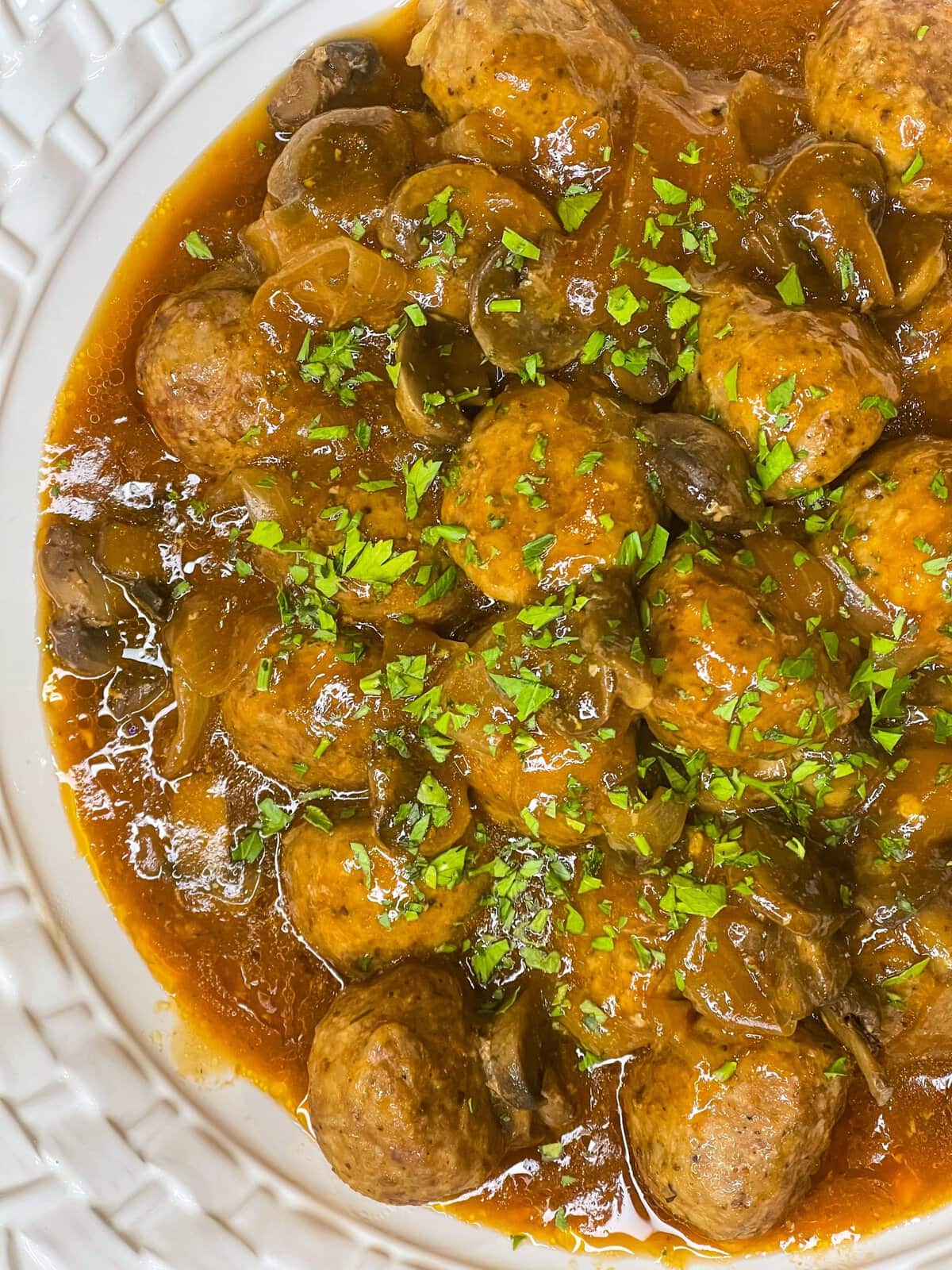 Crock Pot Salisbury Meatballs are juicy meatballs smothered in a flavorful brown gravy served over a big pile of fluffy mashed potatoes. The best thing about this recipe is that you can use homemade or frozen meatballs.