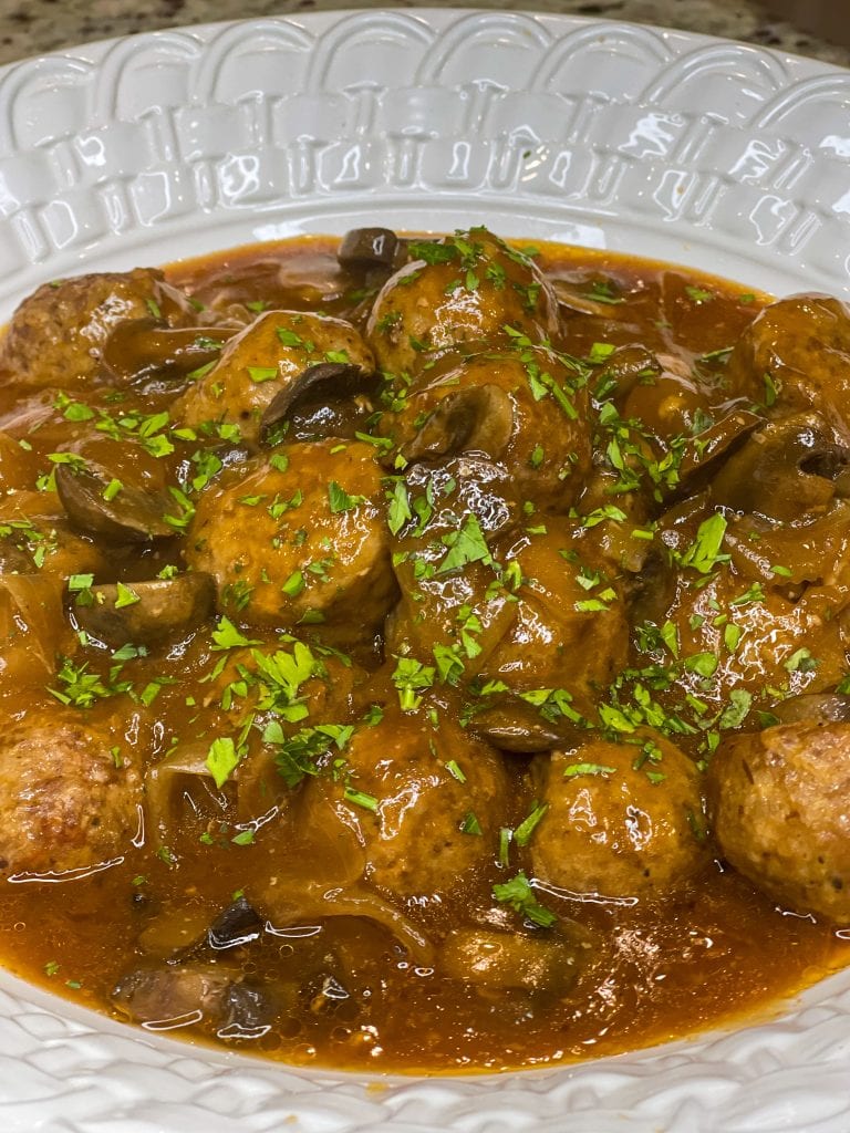 Crock Pot Salisbury Meatballs are juicy meatballs smothered in a flavorful brown gravy served over a big pile of fluffy mashed potatoes. The best thing about this recipe is that you can use homemade or frozen meatballs.