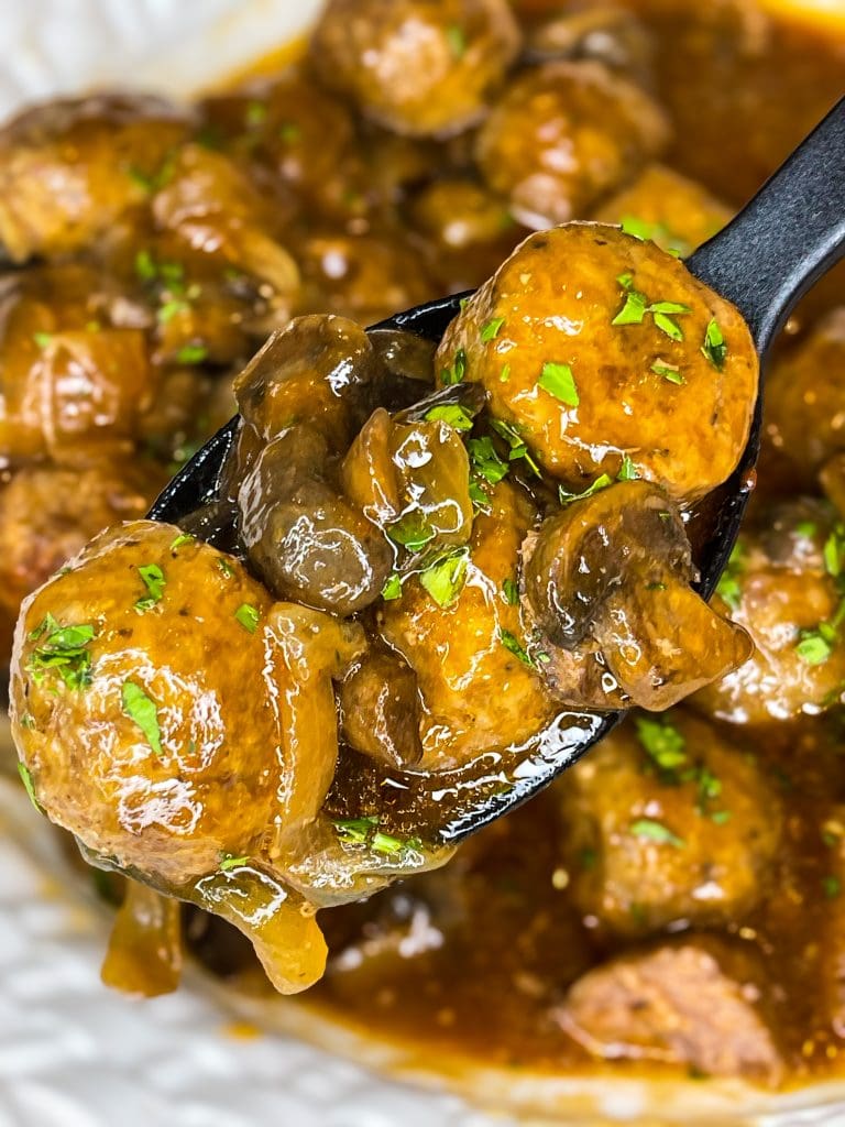 Crock Pot Salisbury Meatballs are juicy meatballs smothered in a flavorful brown gravy served over a big pile of fluffy mashed potatoes. The best thing about this recipe is that you can use homemade or frozen meatballs.