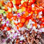 If you love the flavors of the Mediterranean, you'll love this Greek Pasta Salad with tender pasta, kalamata olives, red peppers, cucumbers, juicy tomatoes, tangy red onion, and creamy feta cheese all tossed in an herby olive oil dressing.