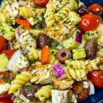 If you love the flavors of the Mediterranean, you'll love this Greek Pasta Salad with tender pasta, kalamata olives, red peppers, cucumbers, juicy tomatoes, tangy red onion, and creamy feta cheese all tossed in an herby olive oil dressing.