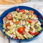 If you love the flavors of the Mediterranean, you'll love this Greek Pasta Salad with tender pasta, kalamata olives, red peppers, cucumbers, juicy tomatoes, tangy red onion, and creamy feta cheese all tossed in an herby olive oil dressing.