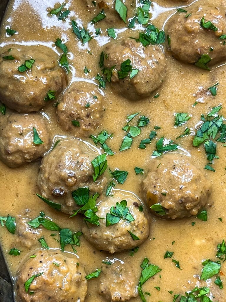 Our family loves Swedish Meatballs. The meatballs are so juicy and the sauce is velvety smooth; really what's not to love! Making Swedish meatballs in the crock pot is so easy. It's a dump and go type of recipe with frozen meatballs, for a short cut, and simple ingredients, like cream of mushroom soup, French onion soup, beef broth, and sour cream.