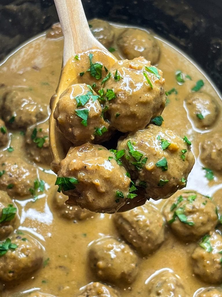 Our family loves Swedish Meatballs. The meatballs are so juicy and the sauce is velvety smooth; really what's not to love! Making Swedish meatballs in the crock pot is so easy. It's a dump and go type of recipe with frozen meatballs, for a short cut, and simple ingredients, like cream of mushroom soup, French onion soup, beef broth, and sour cream. 