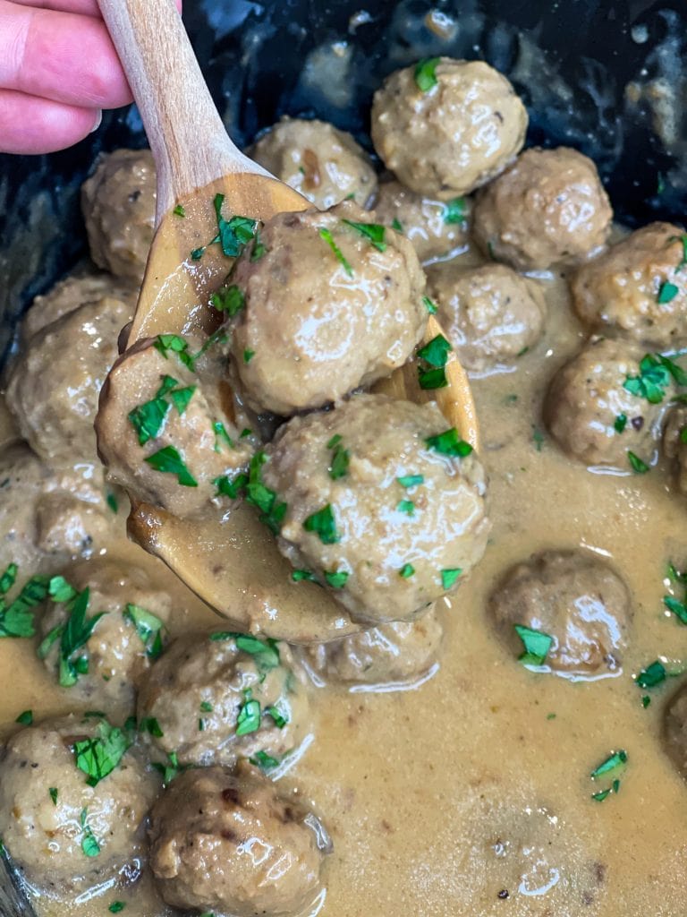 Our family loves Swedish Meatballs. The meatballs are so juicy and the sauce is velvety smooth; really what's not to love! Making Swedish meatballs in the crock pot is so easy. It's a dump and go type of recipe with frozen meatballs, for a short cut, and simple ingredients, like cream of mushroom soup, French onion soup, beef broth, and sour cream.