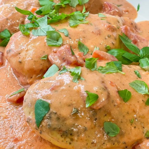 Crock Pot Tomato Basil Chicken a delicious and easy dinner with juicy chicken in a flavorful, creamy tomato based sauce. Serve alone for a low carb option or over pasta for a family friendly meal.