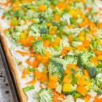 This Crescent Dough Veggie Pizza is the perfect appetizer for any occasion! It starts with a roll of crescent dough with seasoned cream cheese spread across the baked dough and topped with fresh vegetables. It's easy, flavorful, and a crowd pleaser!