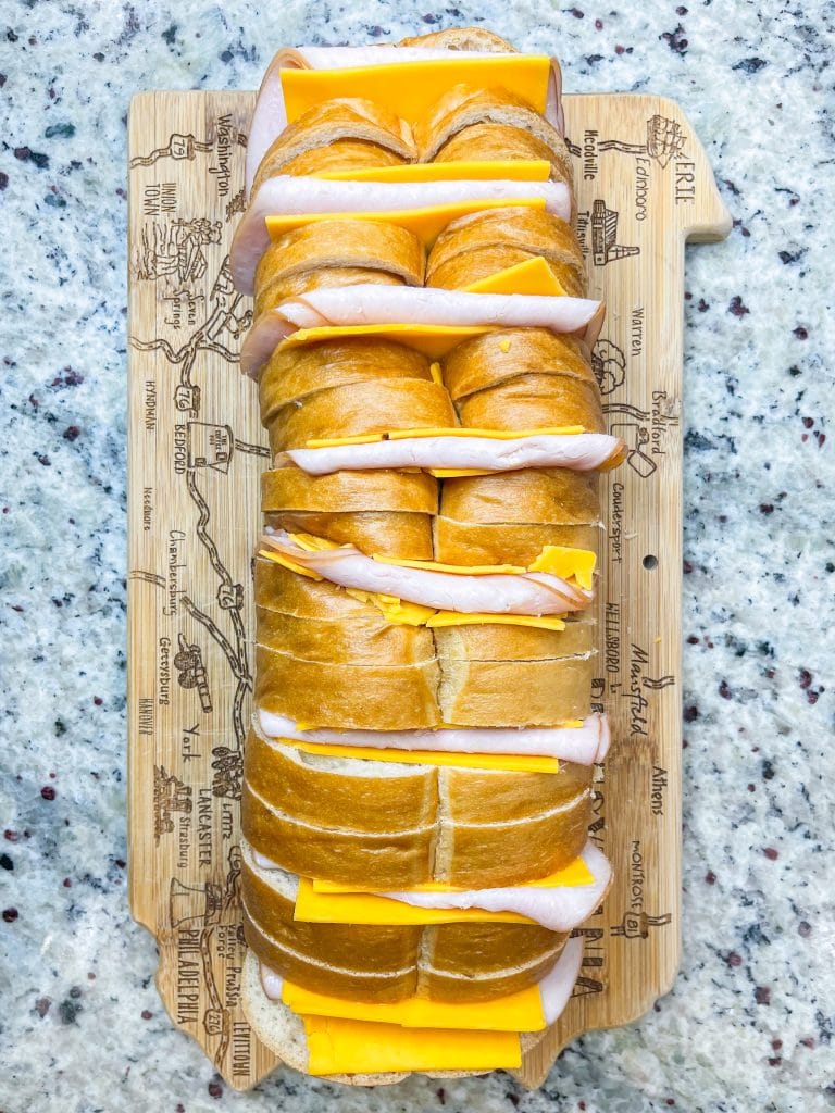 This Hasselback Turkey and Cheese Sandwich is the perfect crowd pleasing weeknight dinner or easy lunch. You can customize it with whatever meat and cheese you like.