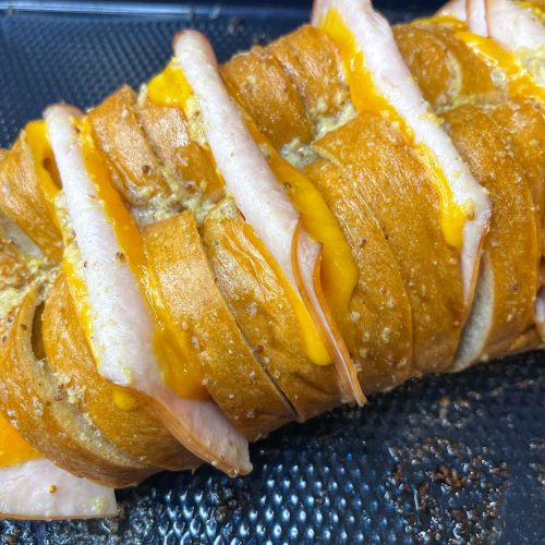 This Hasselback Turkey and Cheese Sandwich is the perfect crowd pleasing weeknight dinner or easy lunch. You can customize it with whatever meat and cheese you like.