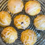 Fruity Pie Biscuit Bombs are delicious little nuggets of blueberry and cherry pie filling (or any fruit pie filling you like!) stuffed into a flaky biscuit round, baked, and covered in a powdered sugar glaze.