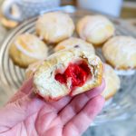 Fruity Pie Biscuit Bombs are delicious little nuggets of blueberry and cherry pie filling (or any fruit pie filling you like!) stuffed into a flaky biscuit round, baked, and covered in a powdered sugar glaze.