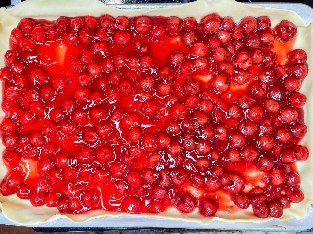 Cherry Slab Pie is the perfect summer dessert to feed a crowd and with only 3 ingredients, it's so easy!