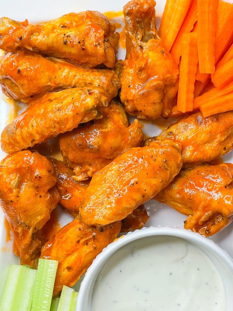 If you haven't made wings in the air fryer yet, this might change your life! Air Fryer Buffalo Wings are crispy, saucy, spicy, super delicious and so easy to prepare. Once you make wings in the air fryer, you may never go back to any other way to prepare them. The air fryer makes chicken wings crispy and flavorful. My life was changed for the better once I discovered ! can cook wings in my air fryer.