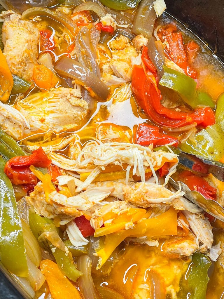 This family friendly recipe, Crock Pot Chicken Fajitas, is super simple to put together and requires just a few ingredients for an easy weeknight dinner. It freezes well too!