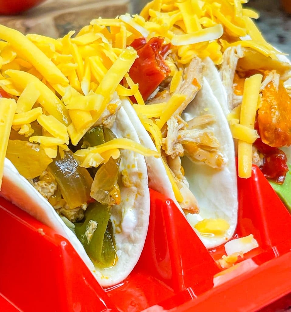 This family friendly recipe, Crock Pot Chicken Fajitas, is super simple to put together and requires just a few ingredients for an easy weeknight dinner. It freezes well too!