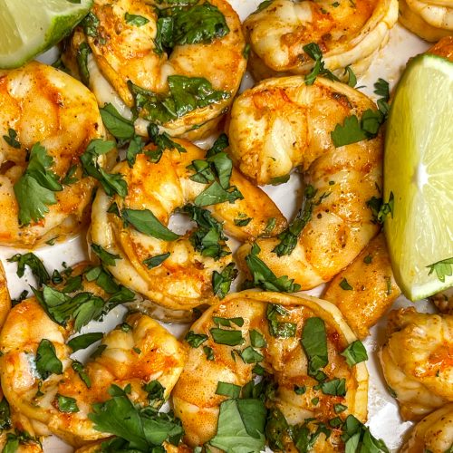 Tangy, spicy and juicy, Air Fryer Chili Lime Shrimp are super easy to make and taste delicious in a shrimp taco, over a bean and rice bowl, or enjoy accompanied with your favorite sides.