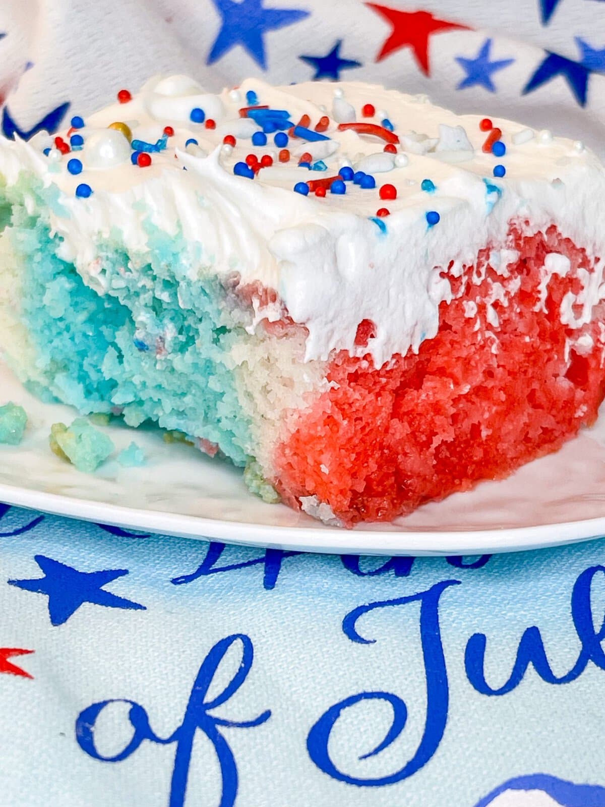 This Patriotic Jello Poke Cake is so easy to make and perfect for the 4th of July!