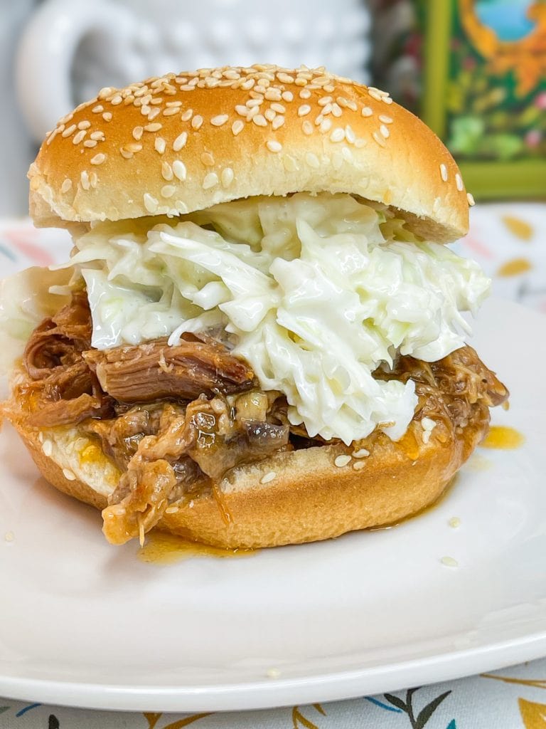 Just 4 simple pantry ingredients to a juicy Crock Pot BBQ Pulled Pork that's perfect to feed a crowd or just an easy, hands off dinner.