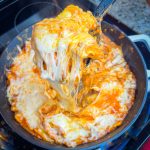 Dinner all in one skillet is the holy grail of meals and this One Pan Cheesy Ravioli is no exception! It's quick, easy, comforting, and best of all-super cheesy. Your family will gobble it up.