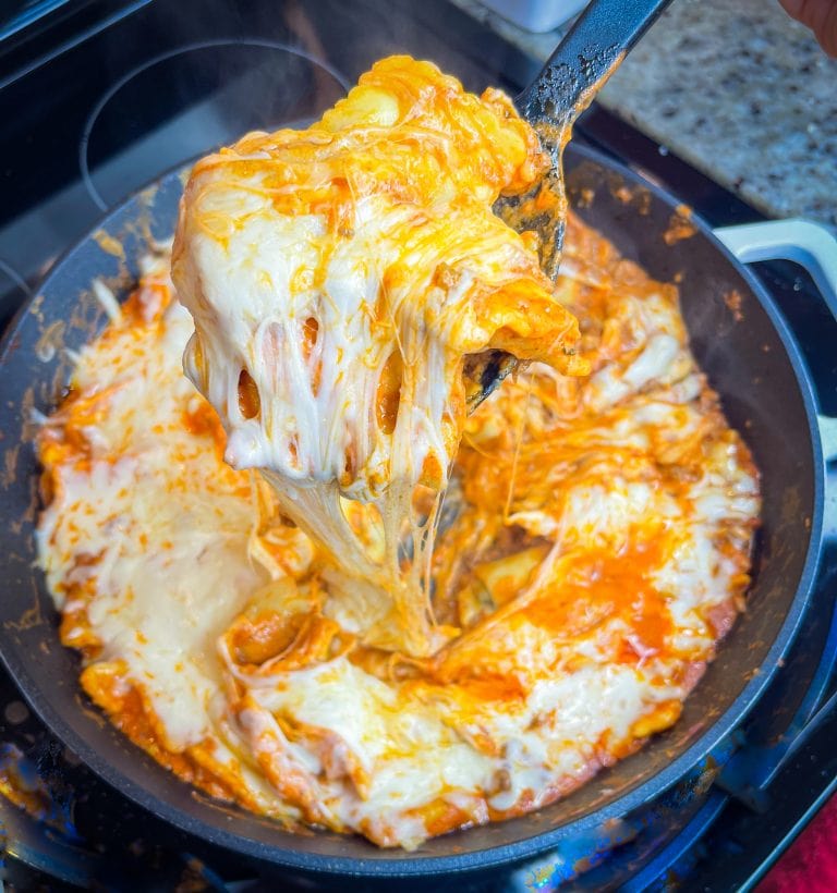 Dinner all in one skillet is the holy grail of meals and this One Pan Cheesy Ravioli is no exception! It's quick, easy, comforting, and best of all-super cheesy. Your family will gobble it up.