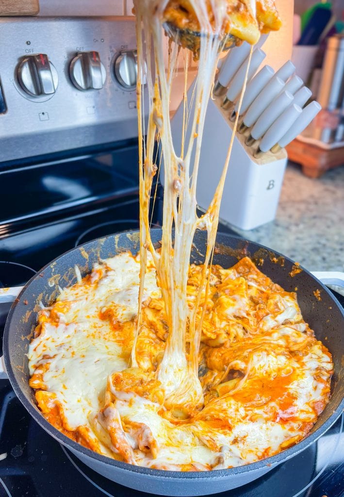 Dinner all in one skillet is the holy grail of meals and this One Pan Cheesy Ravioli is no exception! It's quick, easy, comforting, and best of all-super cheesy. Your family will gobble it up.