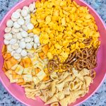 What's the most important thing to remember on a long road trip? The snacks, of course! This Road Trip Snack Mix is filled with all of the favorites; Goldfish crackers, oyster crackers, pretzels, and Bugles seasoned with ranch and spices. It's hard to put down, so it's a good thing this makes a lot!