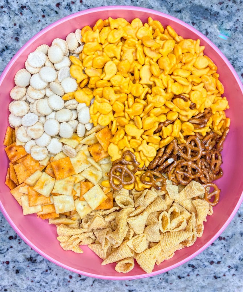 What's the most important thing to remember on a long road trip? The snacks, of course! This Road Trip Snack Mix is filled with all of the favorites; Goldfish crackers, oyster crackers, pretzels, and Bugles seasoned with ranch and spices. It's hard to put down, so it's a good thing this makes a lot!