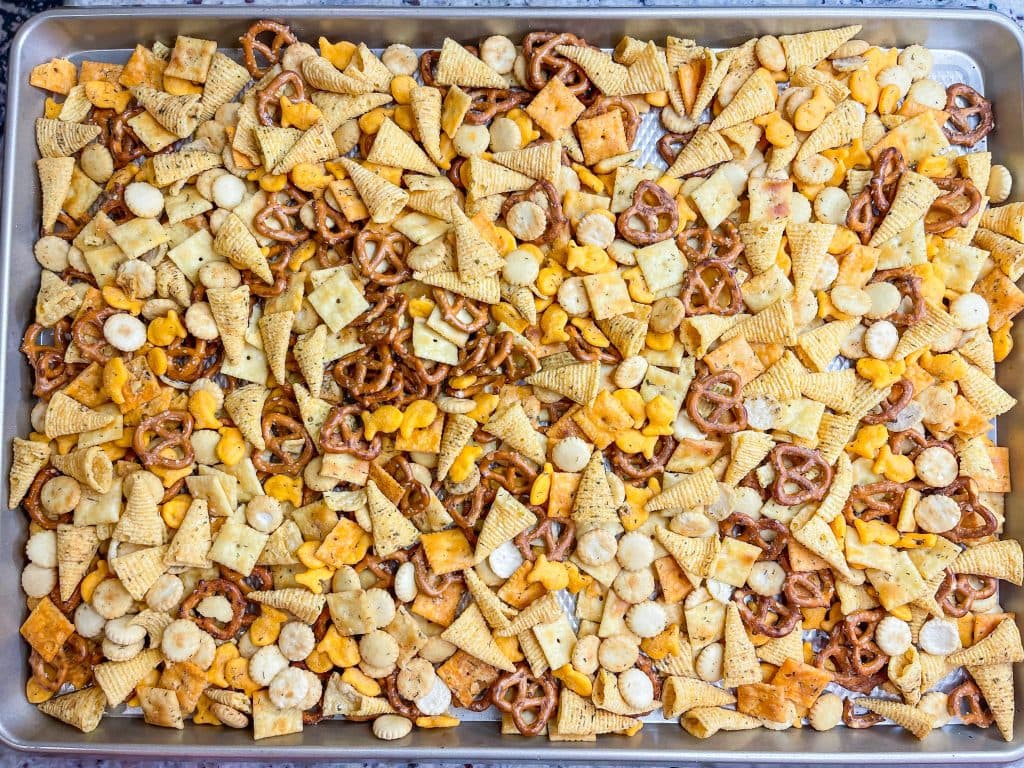 What's the most important thing to remember on a long road trip? The snacks, of course! This Road Trip Snack Mix is filled with all of the favorites; Goldfish crackers, oyster crackers, pretzels, and Bugles seasoned with ranch and spices. It's hard to put down, so it's a good thing this makes a lot!