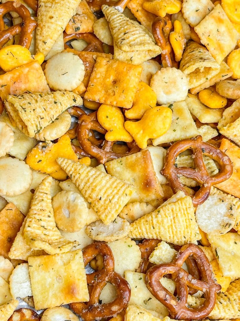 What's the most important thing to remember on a long road trip? The snacks, of course! This Road Trip Snack Mix is filled with all of the favorites; Goldfish crackers, oyster crackers, pretzels, and Bugles seasoned with ranch and spices. It's hard to put down, so it's a good thing this makes a lot!