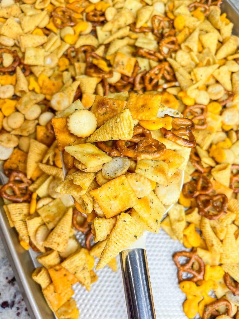 What's the most important thing to remember on a long road trip? The snacks, of course! This Road Trip Snack Mix is filled with all of the favorites; Goldfish crackers, oyster crackers, pretzels, and Bugles seasoned with ranch and spices. It's hard to put down, so it's a good thing this makes a lot!