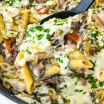 This One Pan Cheesesteak Pasta is filled with ground beef, peppers, onions, penne pasta, and of course, cheese! It's made all in one pan for an easy, family friendly weeknight dinner.