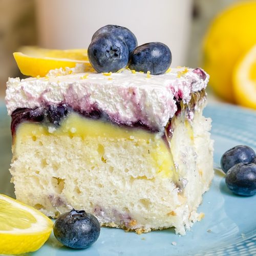 Blueberry Lemon Poke Cake is a refreshing treat great for any time of the year. It's a lemon spiked cake mix topped with creamy lemon pudding, blueberry pie filling and Cool Whip. Easy and delicious!