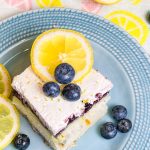 Blueberry Lemon Poke Cake is a refreshing treat great for any time of the year. It's a lemon spiked cake mix topped with creamy lemon pudding, blueberry pie filling and Cool Whip. Easy and delicious!