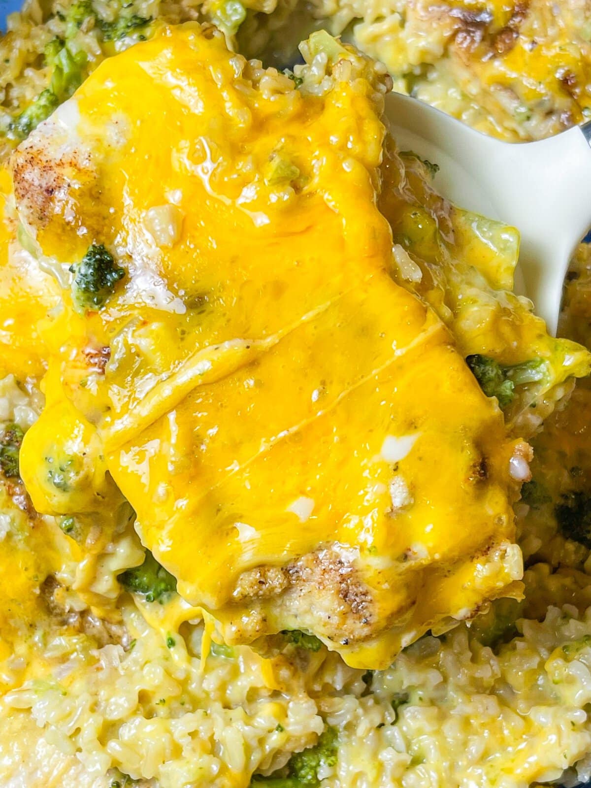 This one dish Cheddar Broccoli Casserole is a full meal in a pan with cheesy, creamy rice, broccoli florets, and juicy chicken. A weeknight staple.