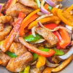 Chicken Fajita Casserole is everything you love about fajitas in a family friendly, one dish casserole. It's a super easy dump-and-bake recipe with rice, bell peppers, onions, fajita seasoned chicken, and melty cheese.