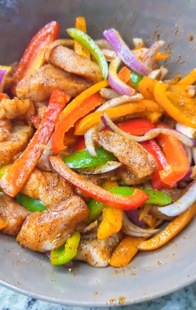 Chicken Fajita Casserole is everything you love about fajitas in a family friendly, one dish casserole. It's a super easy dump-and-bake recipe with rice, bell peppers, onions, fajita seasoned chicken, and melty cheese.