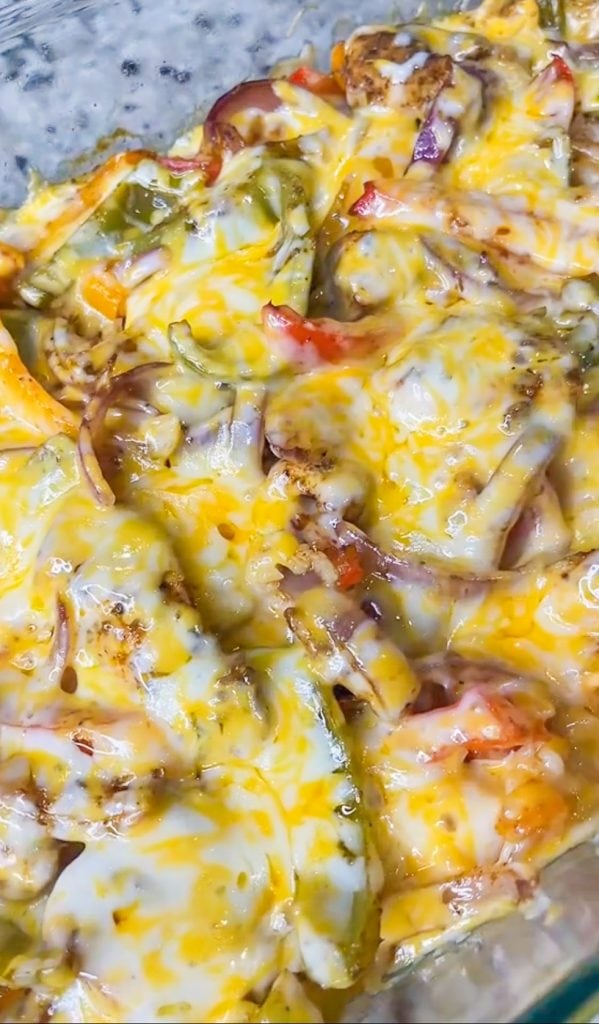 Chicken Fajita Casserole is everything you love about fajitas in a family friendly, one dish casserole. It's a super easy dump-and-bake recipe with rice, bell peppers, onions, fajita seasoned chicken, and melty cheese.