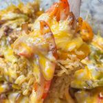 Chicken Fajita Casserole is everything you love about fajitas in a family friendly, one dish casserole. It's a super easy dump-and-bake recipe with rice, bell peppers, onions, fajita seasoned chicken, and melty cheese.