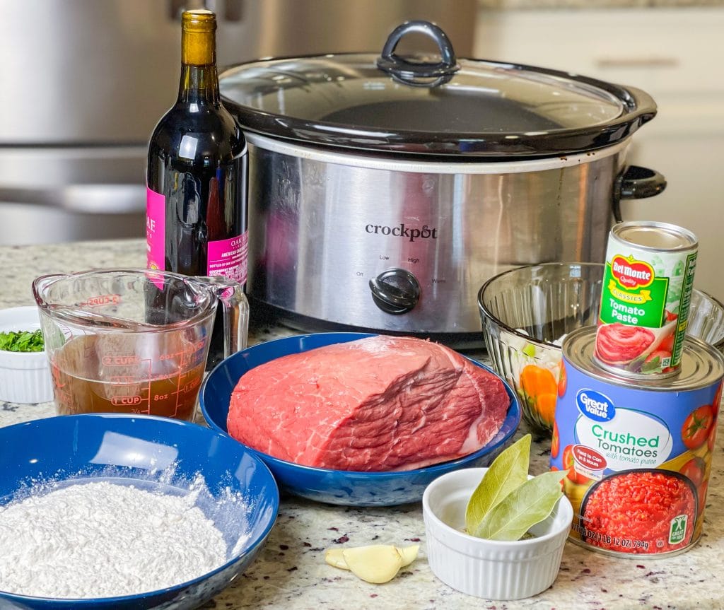 Slow Cooker Beef Ragu is made with chuck roast, which is usually an inexpensive cut of meat and readily available. The roast is quick seared to lock in flavor and combined with red wine, tomatoes, carrots, garlic, onions, and celery before being cooked low and slow all day. The meat just falls apart and the sauce is robust and bold; exactly what you want on a cold fall or winter night. Serve the shredded beef with the tomato sauce over a big bowl of pappardelle or egg noodles along with a side of crusty bread and you have a meal to warm your family on a chilly night.