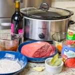 Slow Cooker Beef Ragu is made with chuck roast, which is usually an inexpensive cut of meat and readily available. The roast is quick seared to lock in flavor and combined with red wine, tomatoes, carrots, garlic, onions, and celery before being cooked low and slow all day. The meat just falls apart and the sauce is robust and bold; exactly what you want on a cold fall or winter night. Serve the shredded beef with the tomato sauce over a big bowl of pappardelle or egg noodles along with a side of crusty bread and you have a meal to warm your family on a chilly night.