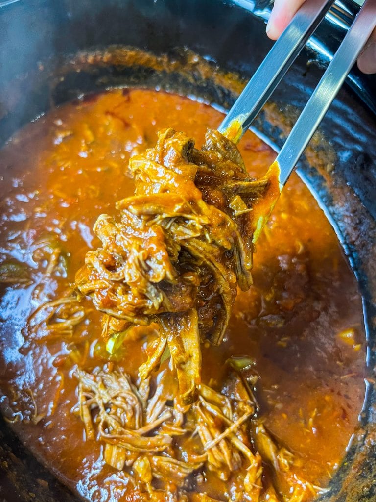 Slow Cooker Beef Ragu is made with chuck roast, which is usually an inexpensive cut of meat and readily available. The roast is quick seared to lock in flavor and combined with red wine, tomatoes, carrots, garlic, onions, and celery before being cooked low and slow all day. The meat just falls apart and the sauce is robust and bold; exactly what you want on a cold fall or winter night. Serve the shredded beef with the tomato sauce over a big bowl of pappardelle or egg noodles along with a side of crusty bread and you have a meal to warm your family on a chilly night.