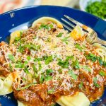 Slow Cooker Beef Ragu is made with chuck roast, which is usually an inexpensive cut of meat and readily available. The roast is quick seared to lock in flavor and combined with red wine, tomatoes, carrots, garlic, onions, and celery before being cooked low and slow all day. The meat just falls apart and the sauce is robust and bold; exactly what you want on a cold fall or winter night. Serve the shredded beef with the tomato sauce over a big bowl of pappardelle or egg noodles along with a side of crusty bread and you have a meal to warm your family on a chilly night.