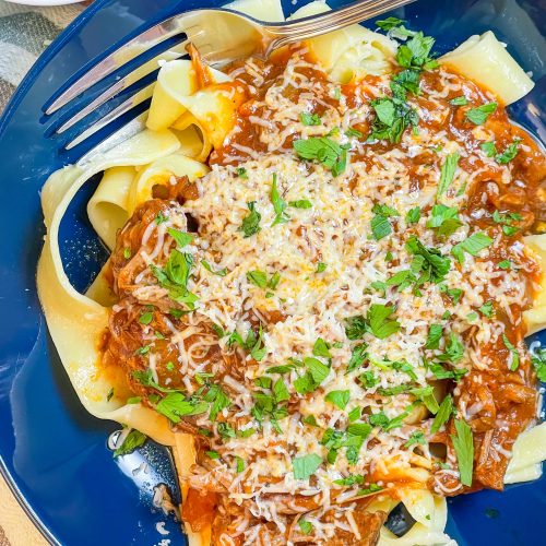 Slow Cooker Beef Ragu is made with chuck roast, which is usually an inexpensive cut of meat and readily available. The roast is quick seared to lock in flavor and combined with red wine, tomatoes, carrots, garlic, onions, and celery before being cooked low and slow all day. The meat just falls apart and the sauce is robust and bold; exactly what you want on a cold fall or winter night. Serve the shredded beef with the tomato sauce over a big bowl of pappardelle or egg noodles along with a side of crusty bread and you have a meal to warm your family on a chilly night.