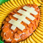 This is the easiest dip to throw together, even last minute! Football Cheese Dip is made with simple panty ingredients: cream cheese, cheddar cheese, and seasonings, but is elevated with the addition of mini pepperoni to resemble a football. Your family and guests will rave! This recipe is easily doubled or tripled for a large crowd and can be prepared a day or two before serving so on game day you can have fun without the hassle.