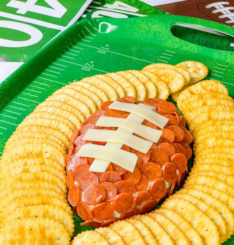 This is the easiest dip to throw together, even last minute! Football Cheese Dip is made with simple panty ingredients: cream cheese, cheddar cheese, and seasonings, but is elevated with the addition of mini pepperoni to resemble a football. Your family and guests will rave! This recipe is easily doubled or tripled for a large crowd and can be prepared a day or two before serving so on game day you can have fun without the hassle.