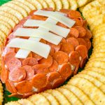 This is the easiest dip to throw together, even last minute! Football Cheese Dip is made with simple panty ingredients: cream cheese, cheddar cheese, and seasonings, but is elevated with the addition of mini pepperoni to resemble a football. Your family and guests will rave! This recipe is easily doubled or tripled for a large crowd and can be prepared a day or two before serving so on game day you can have fun without the hassle.