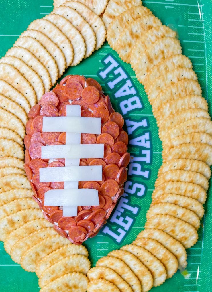 This is the easiest dip to throw together, even last minute! Football Cheese Dip is made with simple panty ingredients: cream cheese, cheddar cheese, and seasonings, but is elevated with the addition of mini pepperoni to resemble a football. Your family and guests will rave! This recipe is easily doubled or tripled for a large crowd and can be prepared a day or two before serving so on game day you can have fun without the hassle.