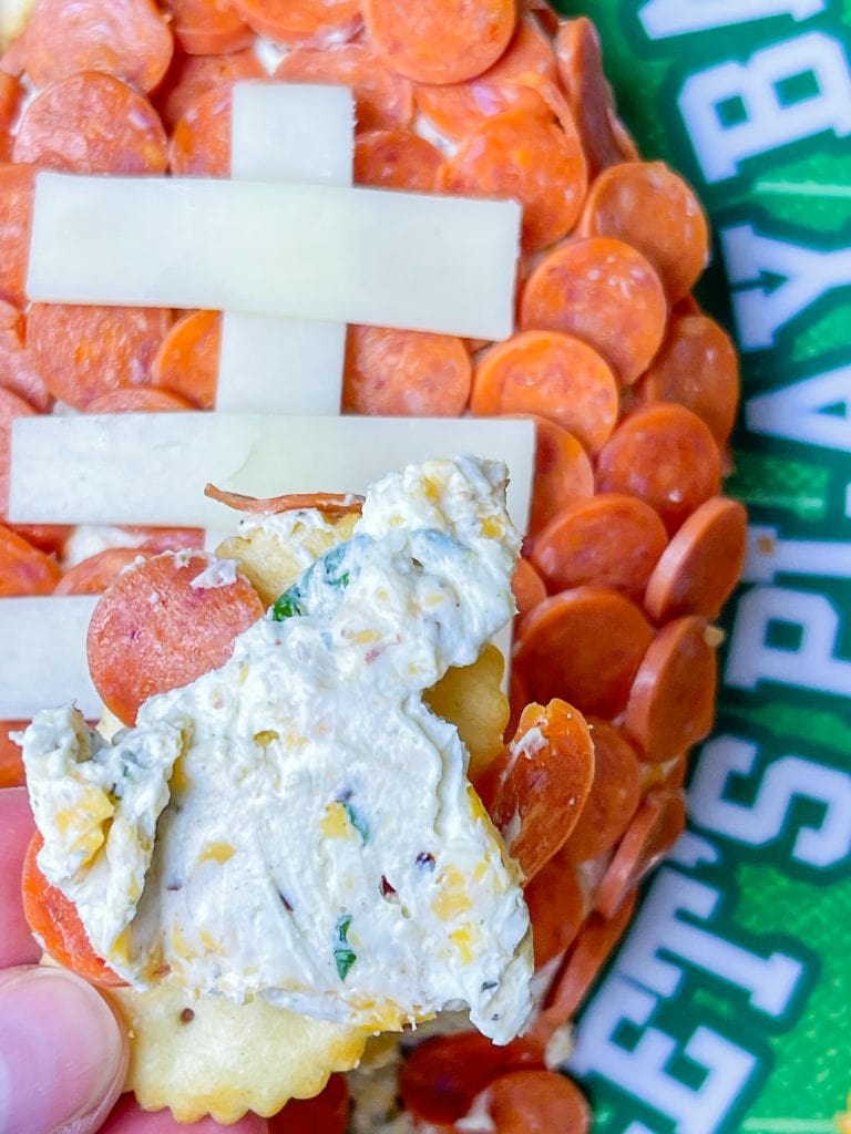 This is the easiest dip to throw together, even last minute! Football Cheese Dip is made with simple panty ingredients: cream cheese, cheddar cheese, and seasonings, but is elevated with the addition of mini pepperoni to resemble a football. Your family and guests will rave! This recipe is easily doubled or tripled for a large crowd and can be prepared a day or two before serving so on game day you can have fun without the hassle.